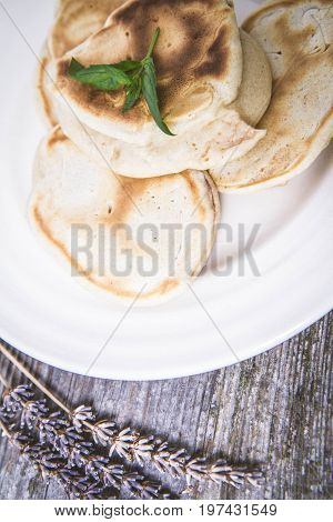 Pancakes with apples decorated with lavender and mint