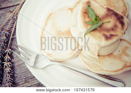 Pancakes With Apples Decorated With Lavender And Mint