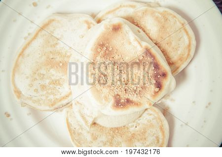 Pancakes with apples decorated with some brown sugar