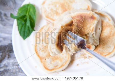 Pancakes With Apples Decorated With Mint And Sugar