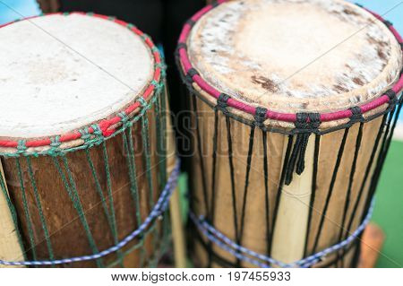 drum, percussion musical instruments and culture concept - closeup on traditional african djembe, summer outdoors concert performance, ethnic rhythm joy show, selective focus