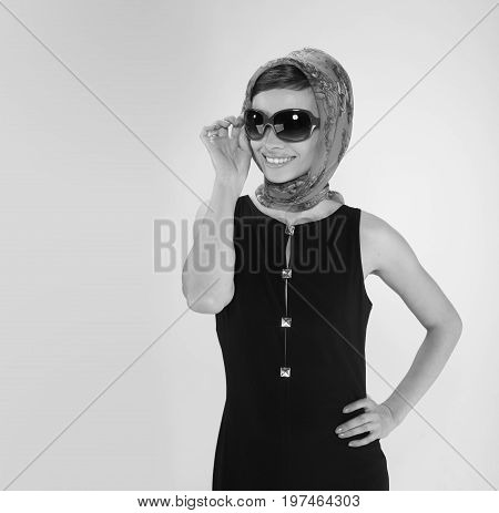 beautiful young woman in retro style with her hair in little black dress