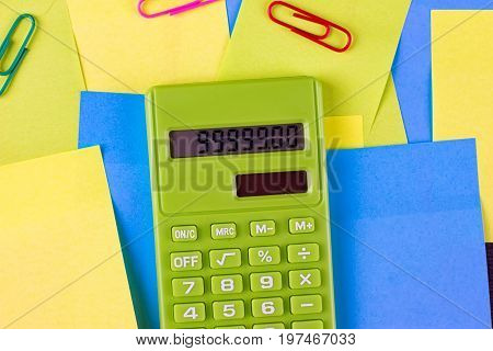 Multi colored pasted stickers and green calculator