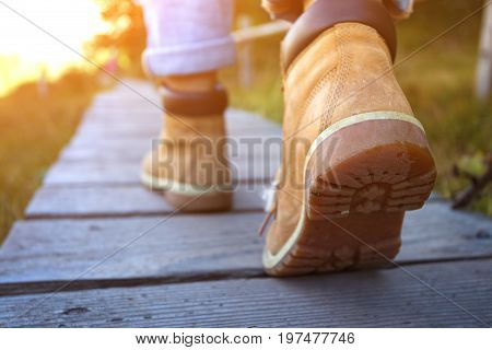 hiking boots close-up. tourist walking at the Puez Odle. Italy