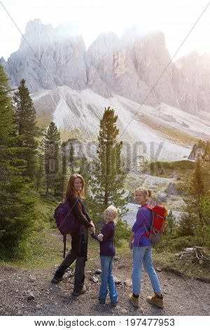 happy family - mother and daughter hiking at the puez odle nature park. Val Gardena to Alta Badia. Italy.