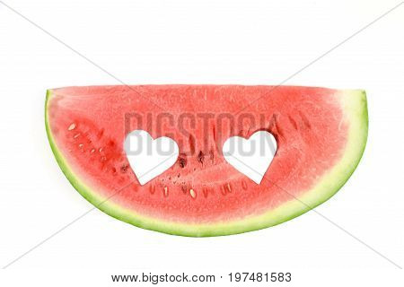 Fresh watermelon slice with carved hearts on white background isolated