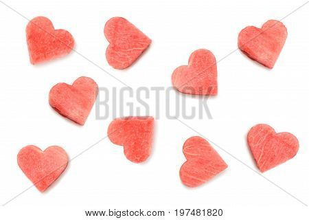 Carved from watermelon slices in shape of hearts on white background isolated