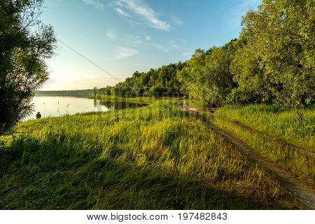 The fisherman catches a pike for spinning off the bank of the channel
