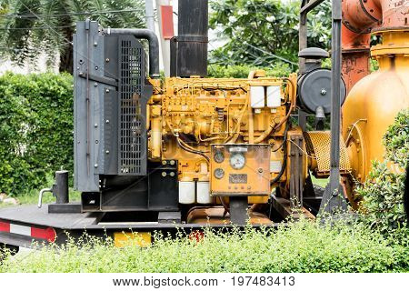 Yellow industrial water pump engine set. Pumping station for flooding control.