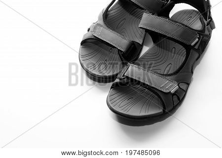 Sandals background / Sandals are an open type of footwear, consisting of a sole held to the wearer's foot by straps going over the instep and, sometimes, around the ankle