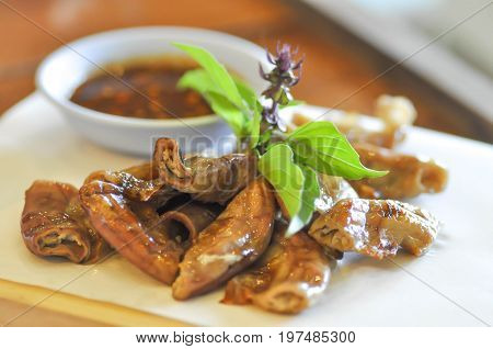 grilled chitterlings or roast chitterlings (Thai food)
