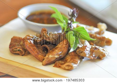 grilled chitterlings or roast chitterlings (Thai food)