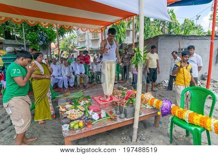 HOWRAH WEST BANGALINDIA - JULY 7TH 2017 : khutipuja the starting ritual of world famous Durga Puja (most famous festival of Hinduism) is being performed by a Hindu Priest amongst Hindu devotees.