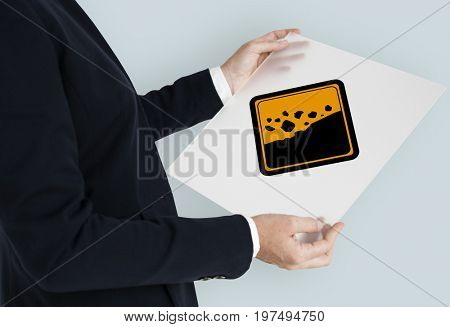 Studio Shoot Holding Banner with Rockfall Beware Sign 