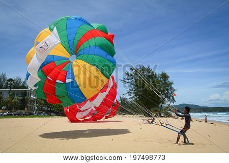 Playing Parasailing In Phuket, Thailand