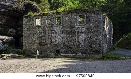 Dolský mlýn. Old building. Ruin of an old mill building. Dolsky mill in national park with old ruin of mill in north Bohemia.