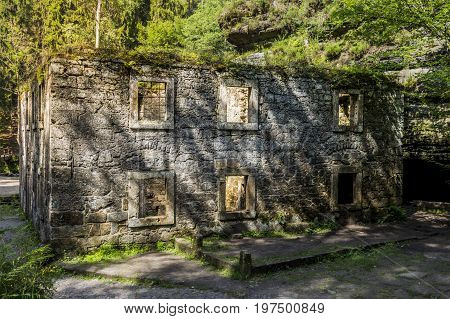 Dolský mlýn. Old building. Ruin of an old mill building. Dolsky mill in national park with old ruin of mill in north Bohemia.