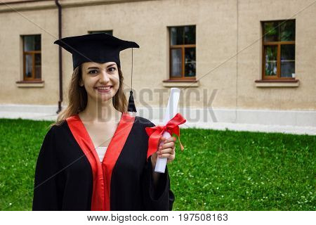 Happy woman on her graduation day. University education and happy people - concept.