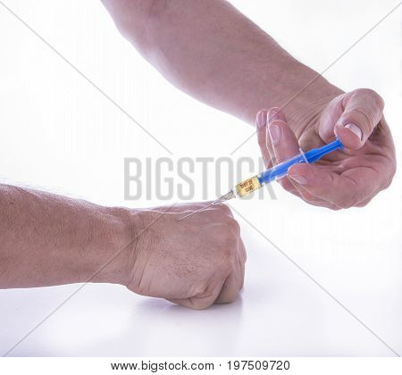 Man giving himself shot of love on white background