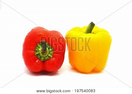 Red and yellow  bell peppers  on white background