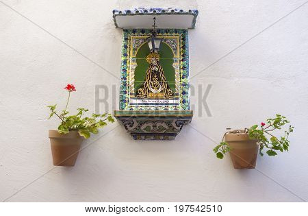 Painting of the Lady of La Soledad on decorative ceramic tiles at old Town Badajos Spain