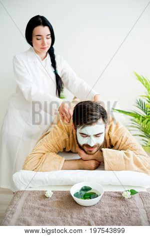 Man enjoying a massage session at spa