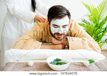 Man enjoying a massage session at spa
