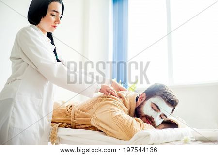 Man enjoying a massage session at spa