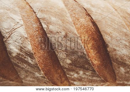 White bread texture crust closeup background, fresh baguette loaf