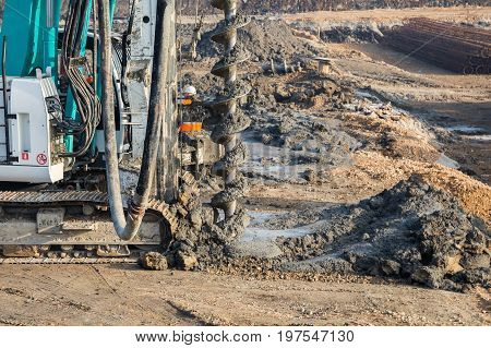 Drilling Tractor Installs Concrete Piles