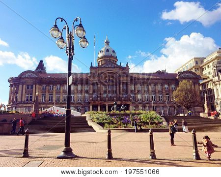 Birmingham, United Kingdom - May 12, 2016: A view to City Council House from Victoria Square in Birmingham, United Kingdom. Locals and tourists. Popular place where locals hang out and chill.
