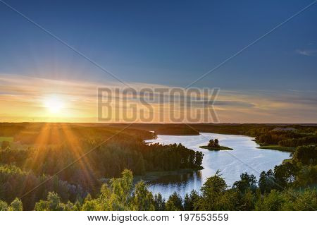 Sun sets over beautiful Jedzelewo Lake. Stare juchy Poland.
