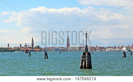 Bell Tower Of Saint Mark And The Church Of Saint George  In Veni