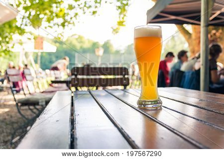 German Beer 0,5 Liter On Wooden Table Biergarten Traditional Culture Beautiful Day