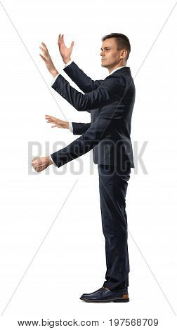 A businessman with four hands making grabbing motions and a fist in side view on white background. Multitasking. Time is money. Project managing.