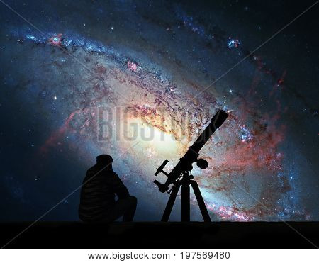 Man With Telescope Looking At The Stars. Spiral Galaxy M106, In The Constellation Canes Venatici. .e