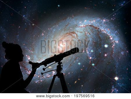 Girl Looking At The Stars With Telescope. Stellar Nursery Ngc 16