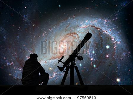 Man With Telescope Looking At The Stars. Stellar Nursery Ngc 167