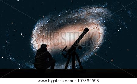Man With Telescope Looking At The Stars. Spiral Galaxy In The Constellation Eridanus Ngc 1300 .eleme