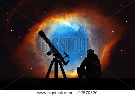 Man With Telescope Looking At The Stars. The Helix Nebula Or Ngc 7293 In The Constellation Aquarius.