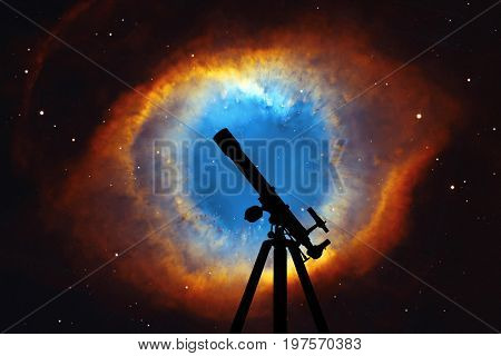 Space Background With Silhouette Of Telescope. The Helix Nebula Or Ngc 7293 In The Constellation Aqu