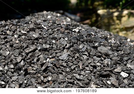The mass of high-quality coal anthracite glitters on the sun.