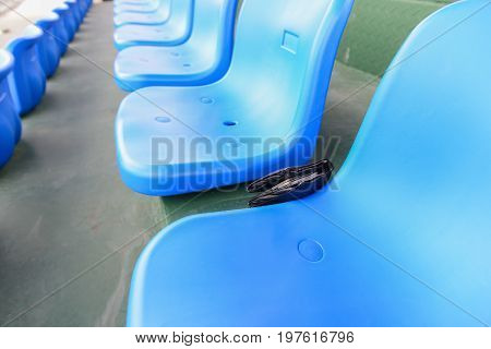 lost wallet lying on a stadium seat