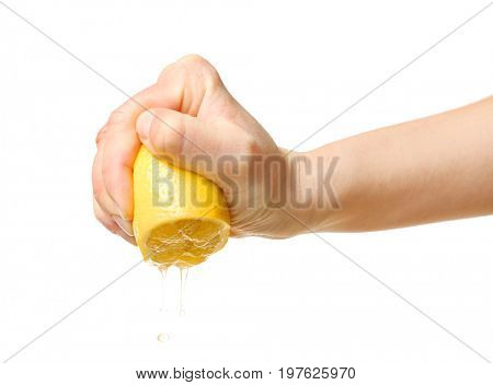 Female hand squeezing half of lemon on white background