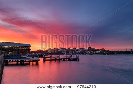 Sunset at Wharf on Darling Harbour with Fishingman Sydney Australia