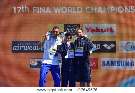 Budapest Hungary - Jul 30 2017. NAVRATIL Michal (CZE) LO BUE Steve (USA) and DE ROSE Alessandro (ITA) the winners of the Men's High Diving Competition. FINA High Diving World Campionships.