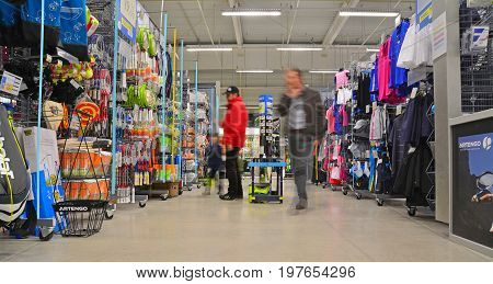 brasov romania - march 5th 2015: customer inside the decathlon sports equipment store in brasov romania. shot taken on march 5th 2015