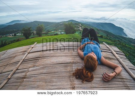 Asian women travel sleep relax. Morning atmosphere nature Forests mountains. Phu Thap Buek Thailand