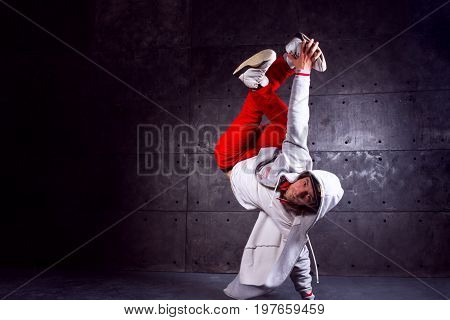 Guy break dancing isolated on black background. Urban style