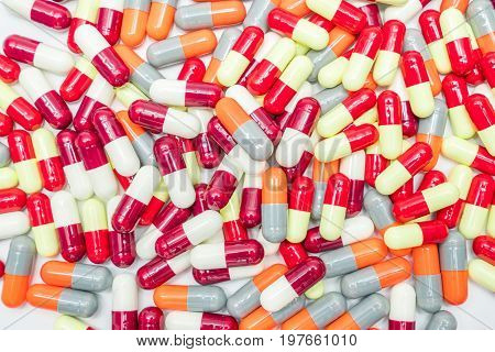 Colorful of antibiotic capsules pills on white background drug resistance